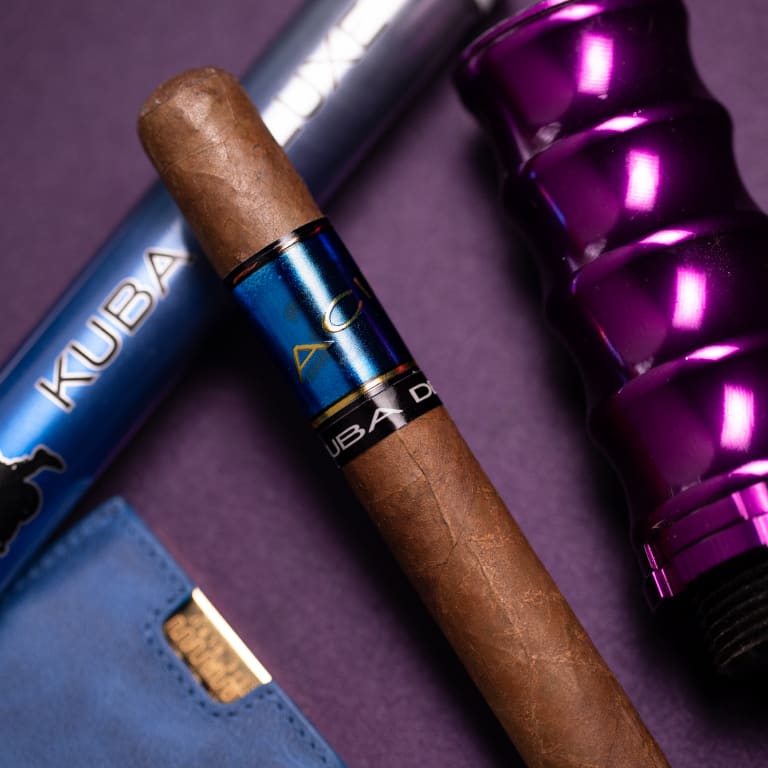 acid blue cigar rests on a blue cigar next to a purple case