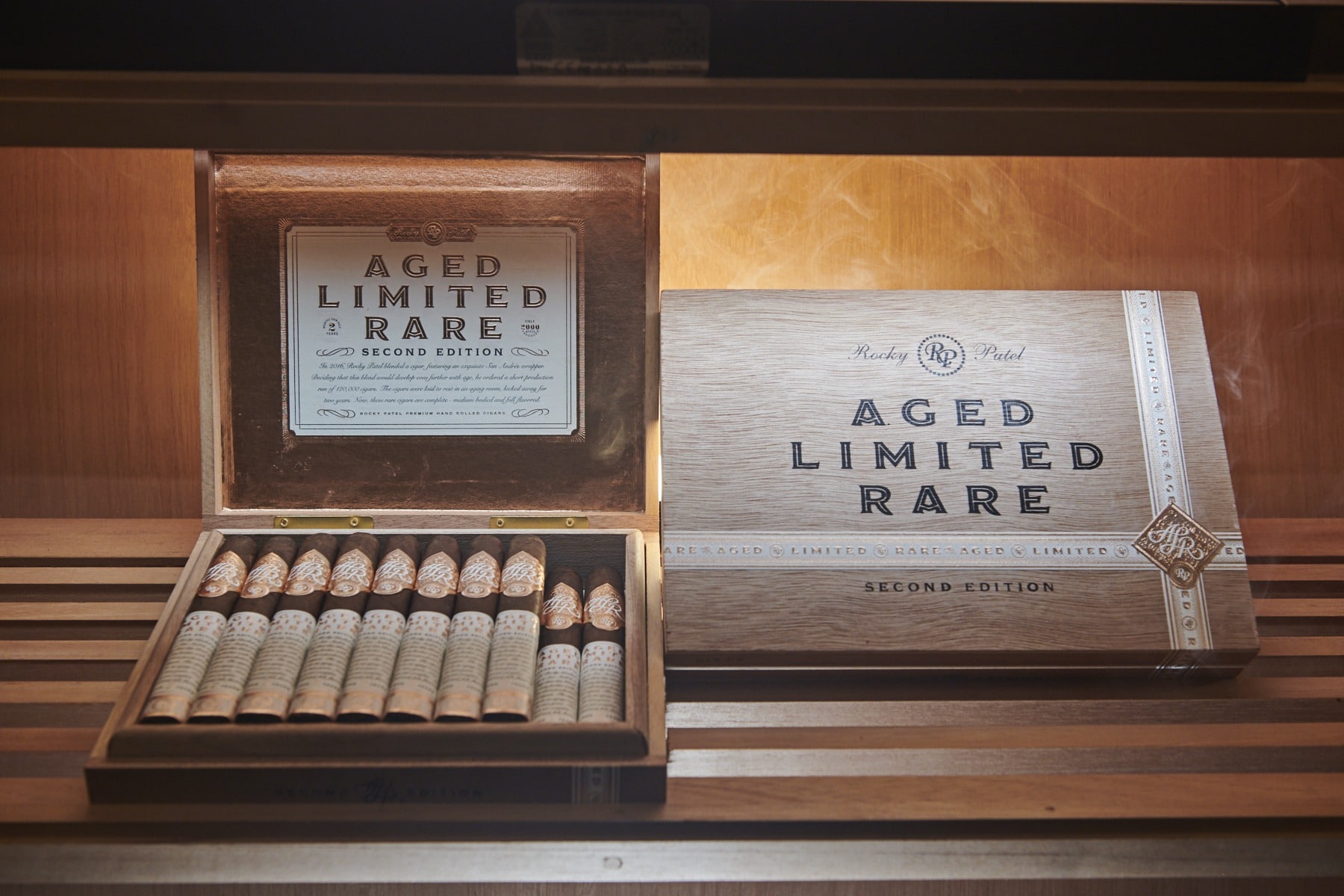 A.L.R. Second Edition wooden cigar box with cigars and a companion box labeled 'AGED LIMITED RARE SECOND EDITION'.
