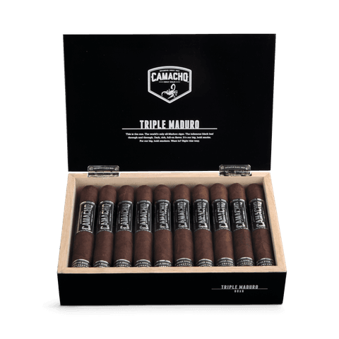 Open Camacho Triple Maduro box showing banded cigars and 'TRIPLE MADURO' on the lid