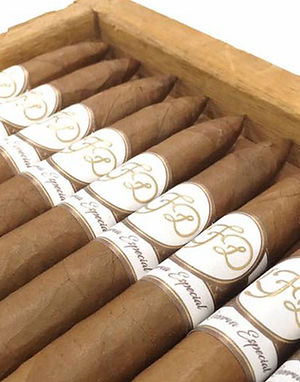 Box of La Flor Dominicana Reserva Especial cigars with white-and-gold bands