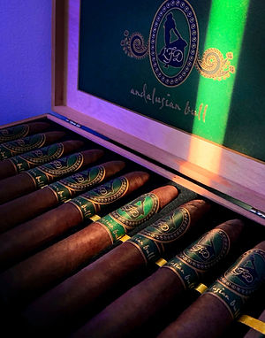 Open box of Andalusian Bull cigars with green bands and inner lid showing the logo and 'andalusian bull' script