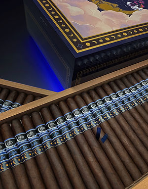 Open La Flor Dominicana La Nox cigar box showing rows of cigars with blue La Nox bands and night-themed box artwork.
