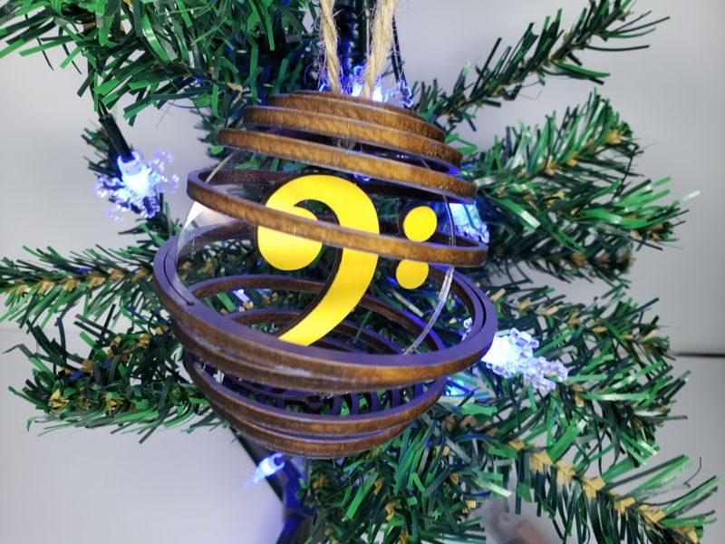 Handcrafted Spiral Wood Globe Ornament - Unique Laser-Cut Musician's Gift - Personalized Instrument Nesting - Customizable Colors