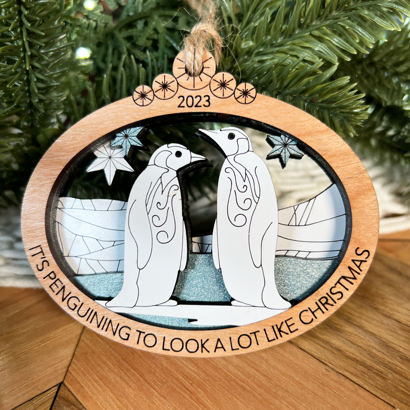 Handcrafted Penguin Christmas Ornament: Multi-Layered Laser Cut with Punny Holiday Phrase